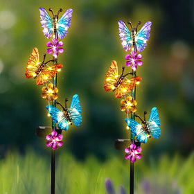 YHSOLAR butterfly stake lights create warm glow along paths.