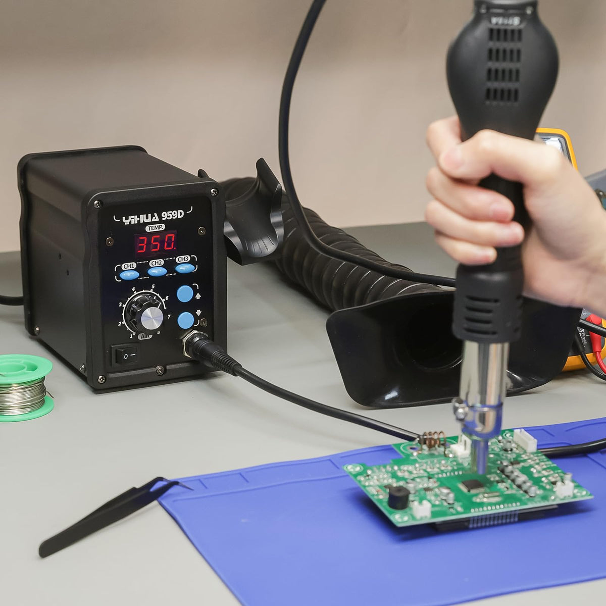 YIHUA 959D station in use on a clean workbench.