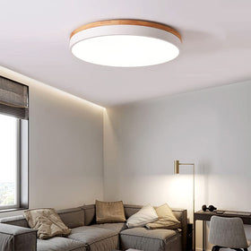 Yiisem flush mount with acrylic shade highlights slim, near-ceiling profile.