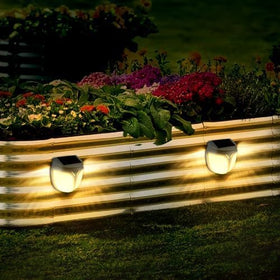 YINDUZ IPX4 waterproof housing protects lights in rain along garden paths.