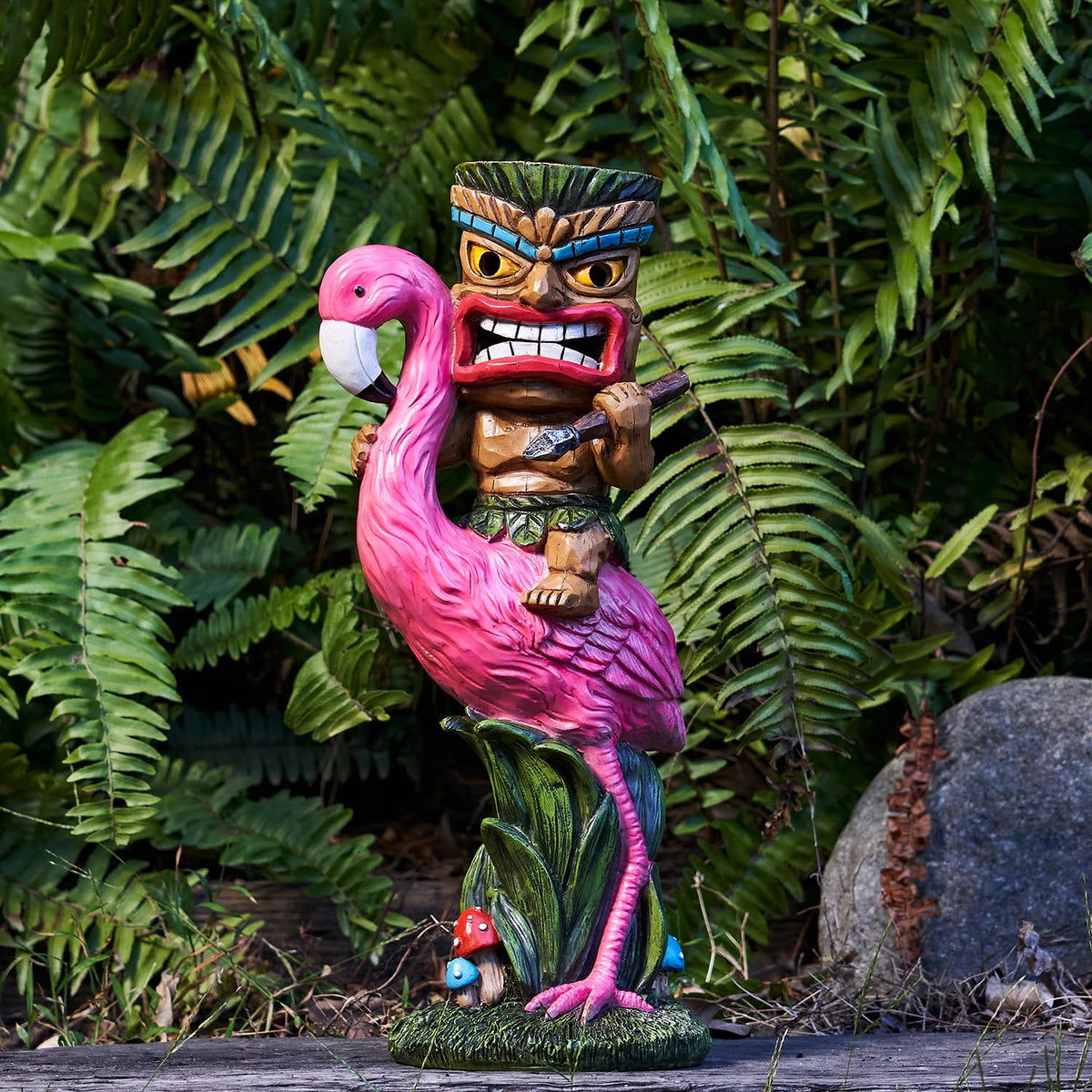 Yiosax Solar Tiki Statue front view in garden with warm glow.