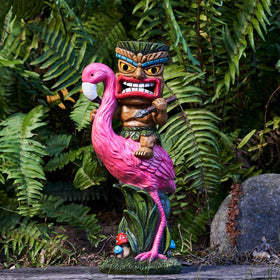 Yiosax Solar Tiki Statue front view in garden with warm glow.