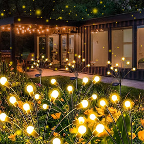 YIQU Solar Firefly Lights with warm white glow along garden path for inviting evenings.