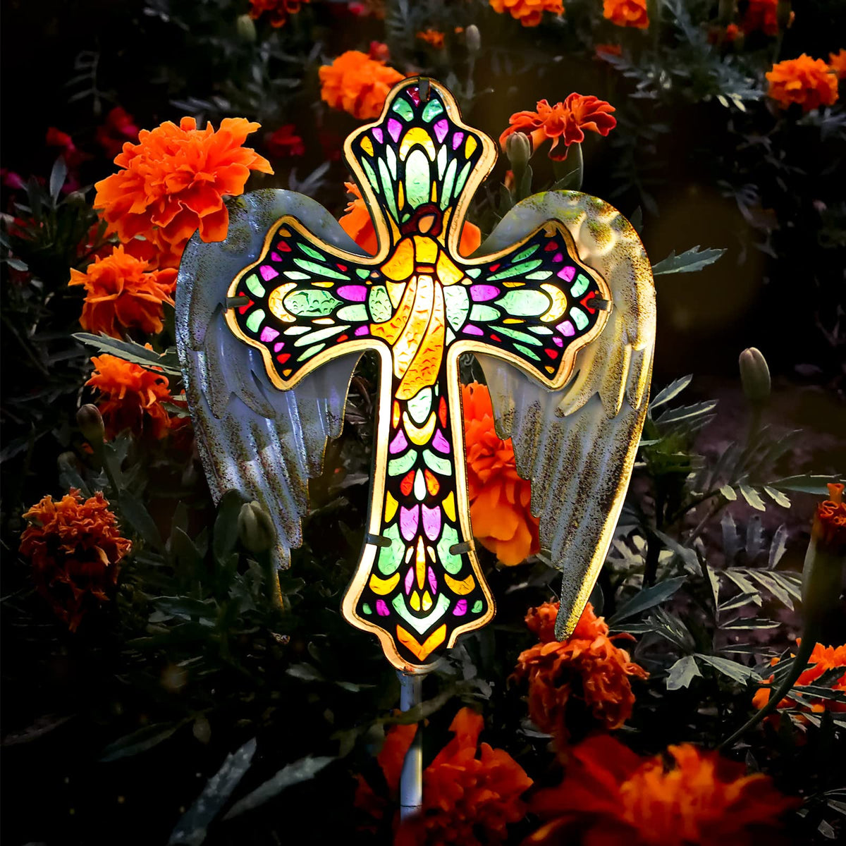 YJFWAL solar glass cross garden stake light illuminating a walkway at dusk
