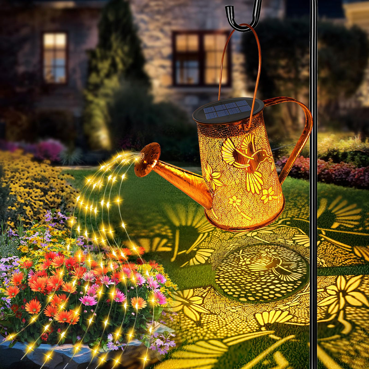 YJFWAL solar watering can lights with hummingbird pattern brighten your garden at night.