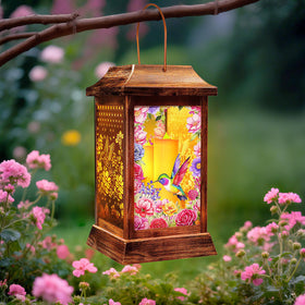 Yulloyello hummingbird solar lantern front view adds warm ambient light to outdoor spaces.