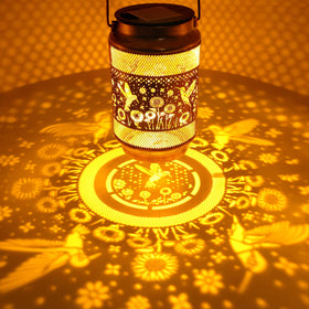 Yulloyello openwork hummingbird lantern adds decorative light to porches.