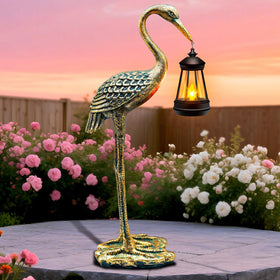 yulloyello solar garden crane figurine glowing at dusk for outdoor ambiance.