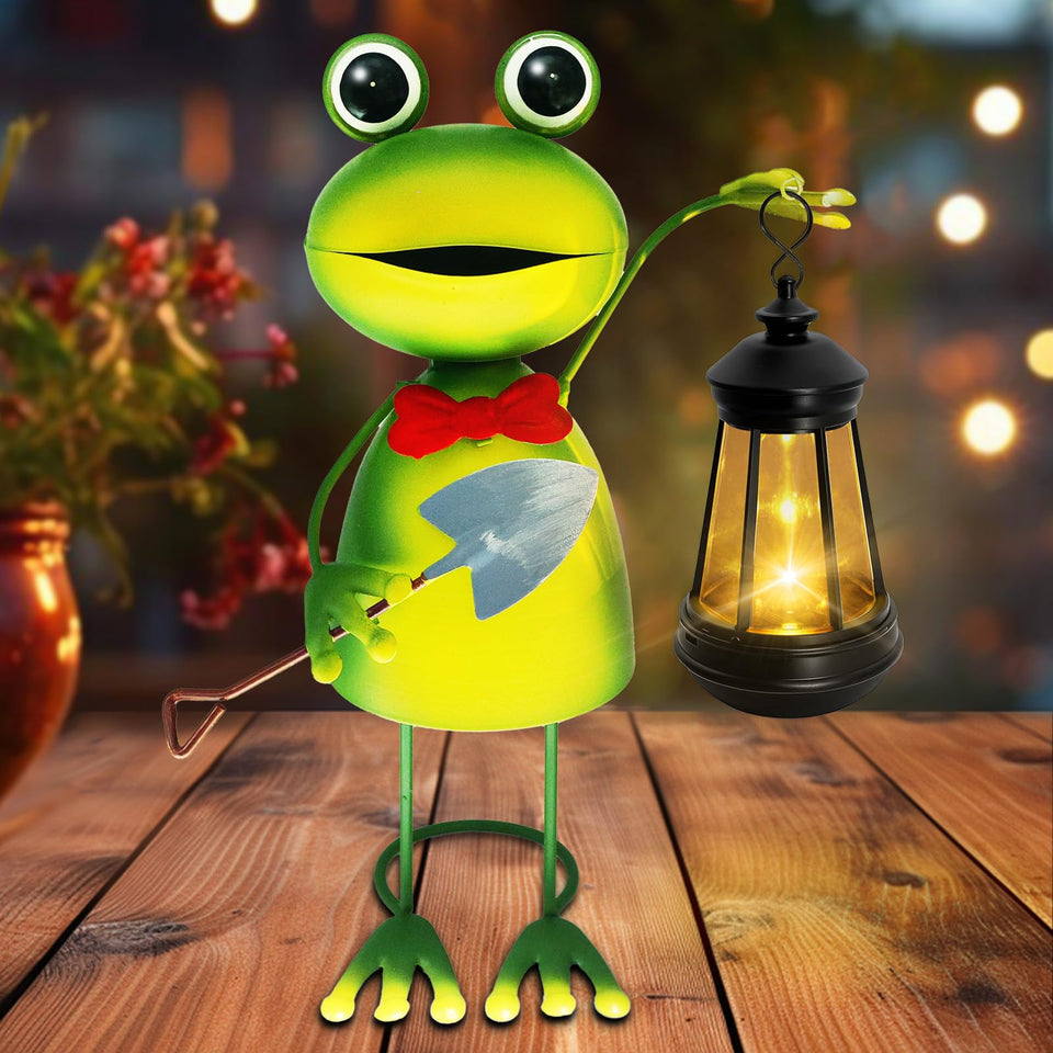 yulloyello solar garden lights frog statue glowing softly in the garden at dusk