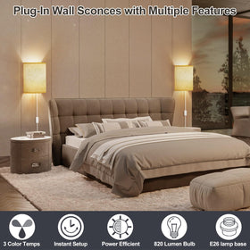 Bedroom-lit Yunaking wall sconce creating cozy reading light.
