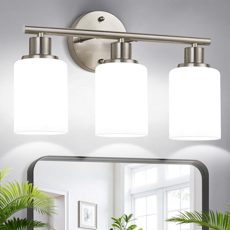 Zarbitta 3-light brushed nickel vanity light over mirror provides modern, even illumination.