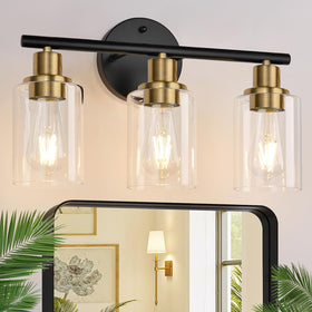 Zarbitta 3-light bathroom fixture with black and gold glass shades for elegant morning routines.