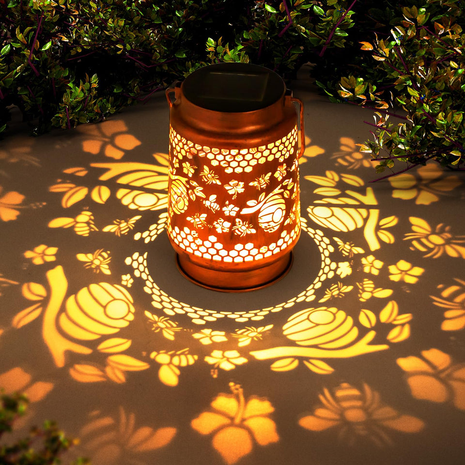ZASOWUUO Bee solar lantern on patio creates warm ambient light for relaxing evenings.