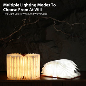 ZBOLE Magic Truth Book Light on a desk enhances nighttime reading experience.