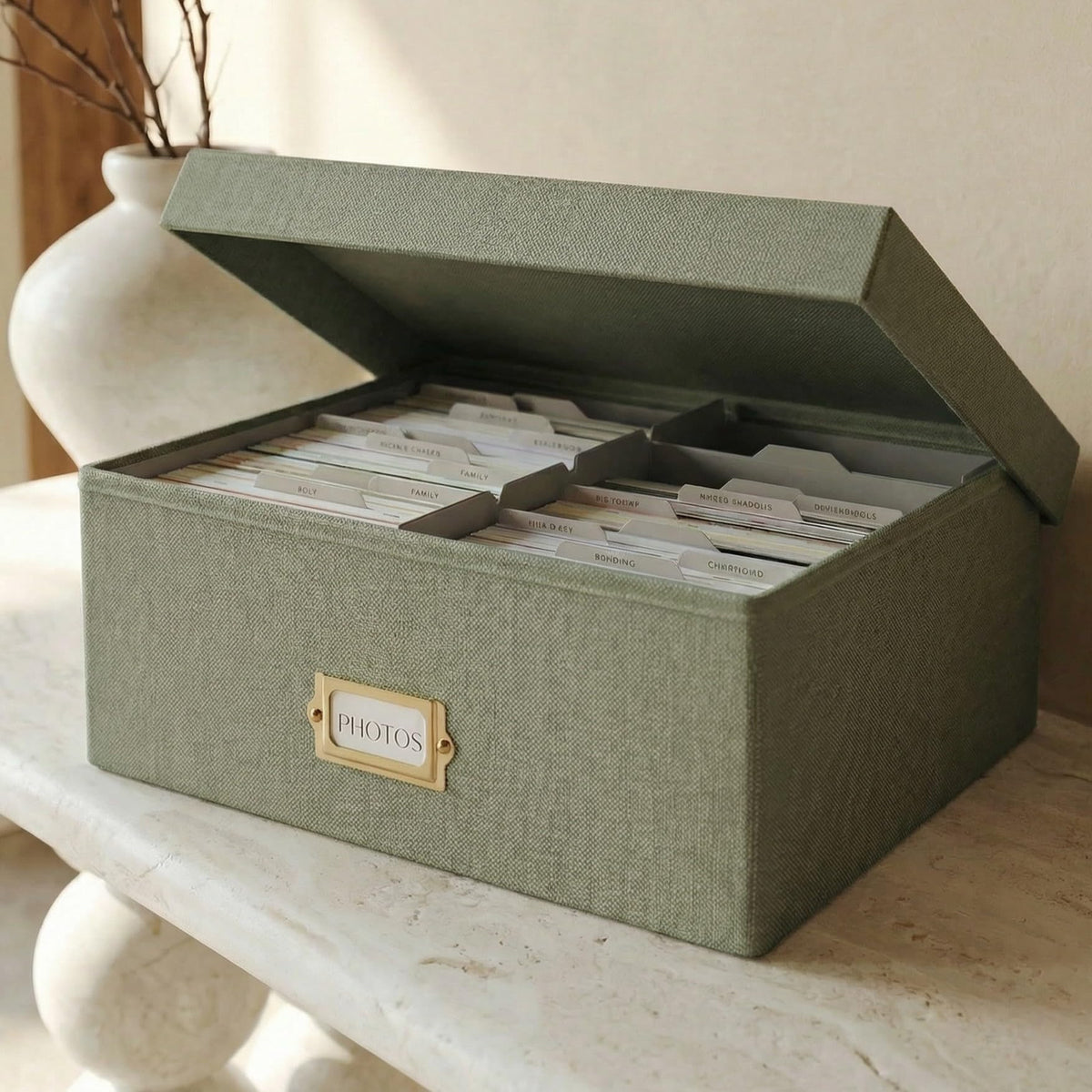 ZICOTO decorative photo box with lid showing eight compartments for 4x6 photos.
