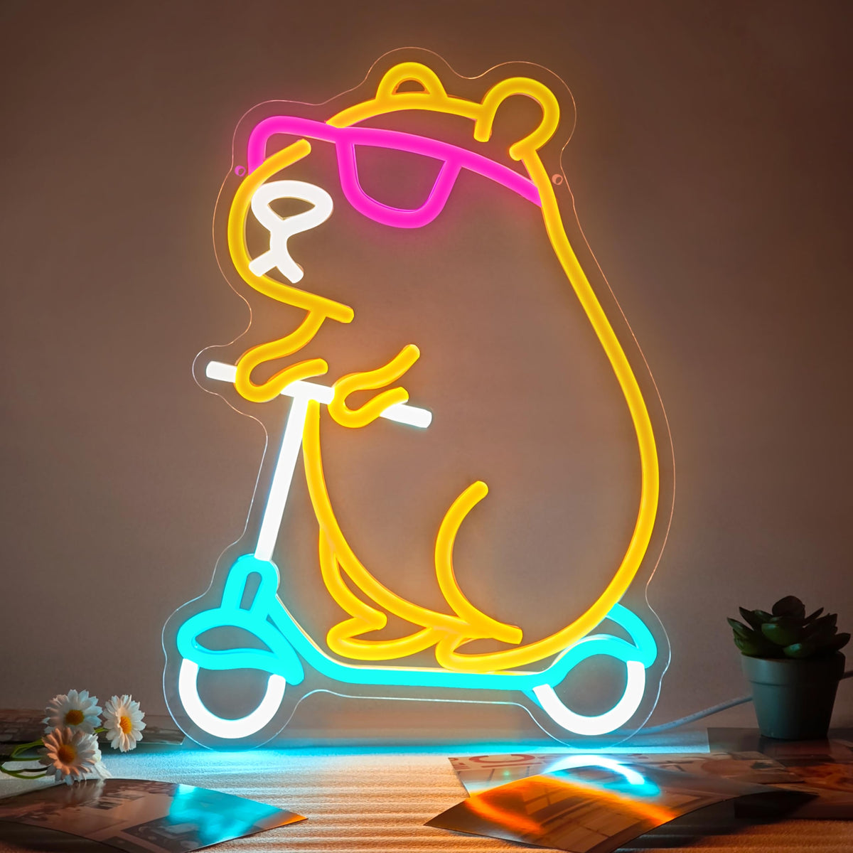 Zidoni Capybara neon sign with scooter for bright wall decor in kids' rooms.