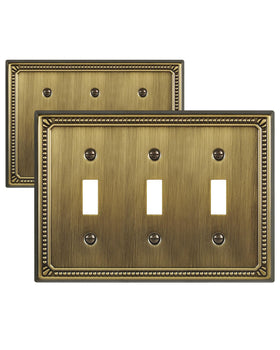 ZILLSEA antique-brass pearl plate adds timeless elegance on a three-toggle wall switch