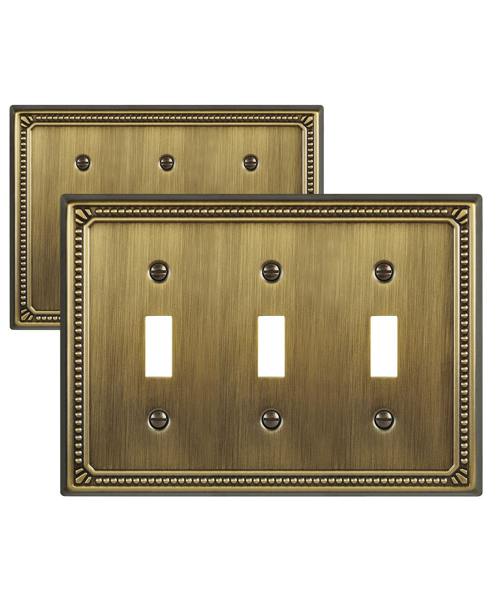 ZILLSEA antique-brass pearl plate adds timeless elegance on a three-toggle wall switch