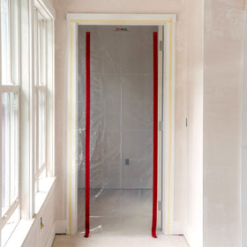 ZIPWALL barrier setup uses lightweight poles for fast one-person installation.