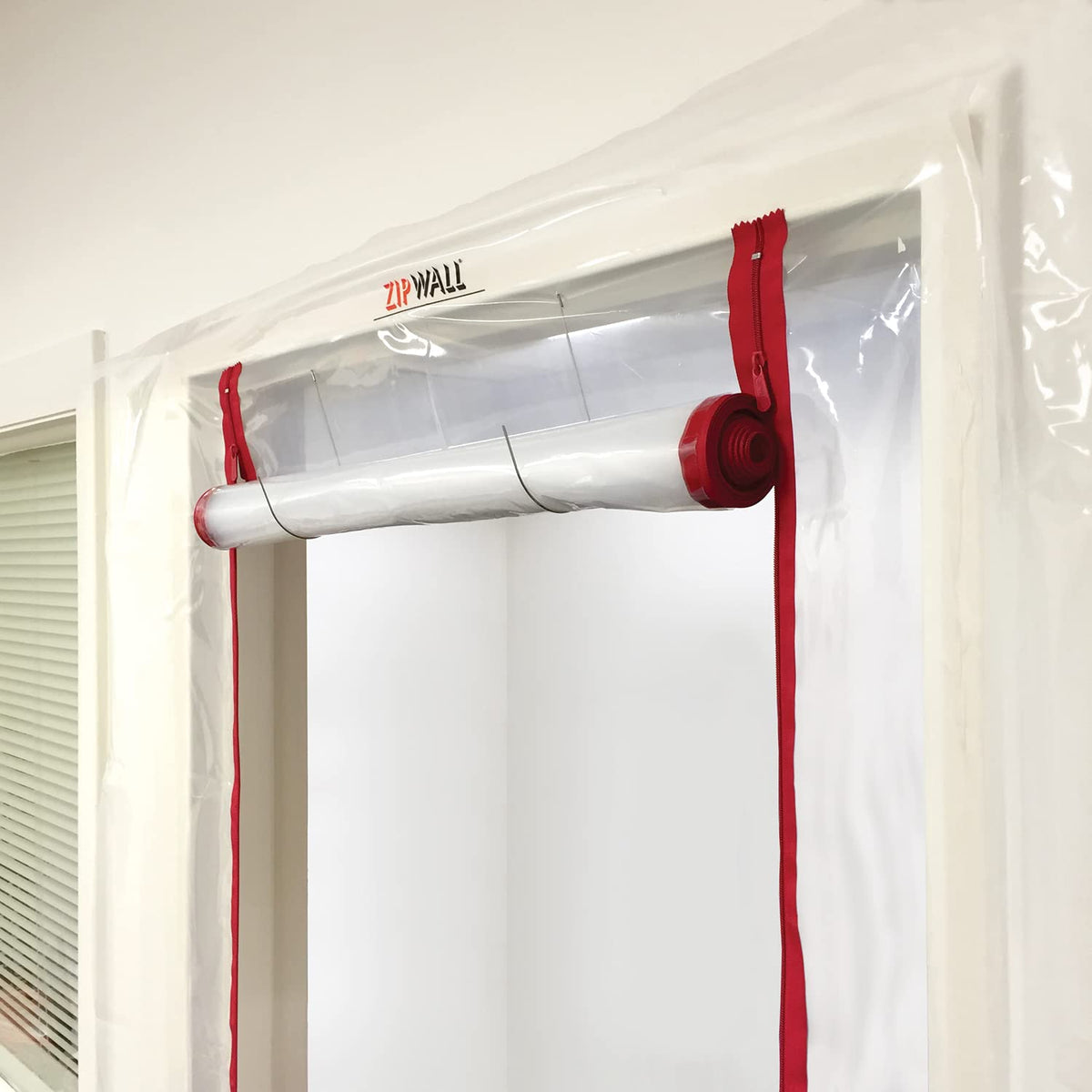 Close-up of tape sealing the ZIPDoor panel without damaging surfaces.
