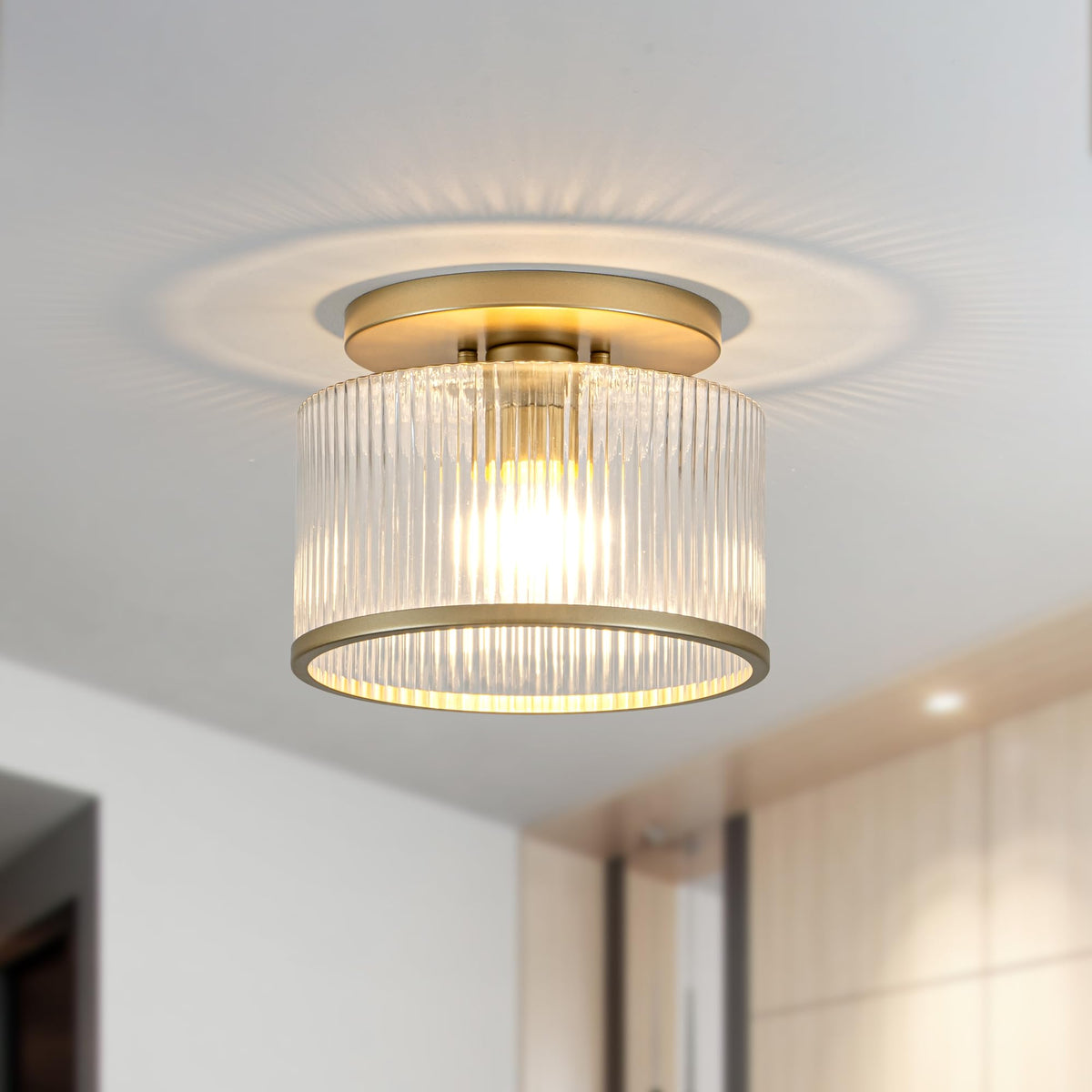 Zlepmlla ceiling light features a gold frame for modern elegance.