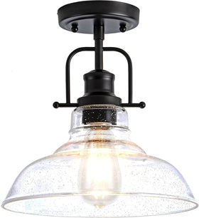 Zlepmlla flush mount light with black metal frame and seeded glass shade for vintage ambiance.