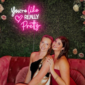 Zoaept Pink heart patterns on neon sign add playful romantic vibe.
