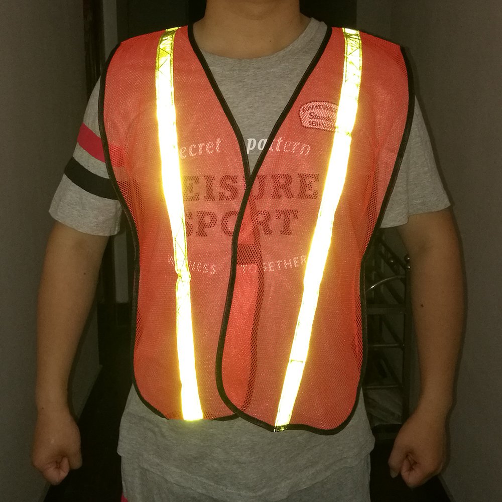 Durable fabric close-up of Zojo reflective vest in neon orange
