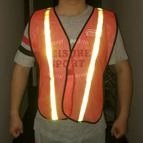 Durable fabric close-up of Zojo reflective vest in neon orange