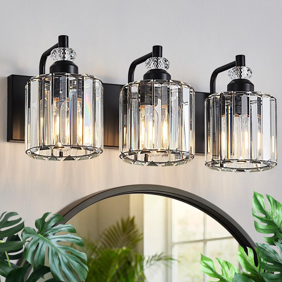 Zqoyn 3-light black crystal vanity light over mirror with warm glow.