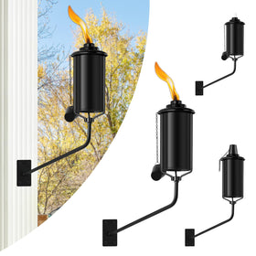ZSZMFH wall-mounted citronella torch 4-pack glows on a wall, creating warm outdoor ambiance.