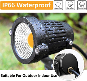 ZUCKEO warm-white LED spotlight highlighting a tree for ambient yard decor.