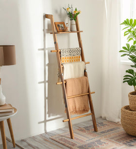 ZUNTO blanket ladder with top shelf displaying decor for a cozy living room