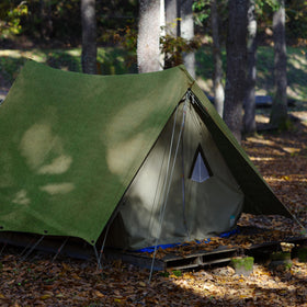 Vehicle gear covered by Zuperia tarp to prevent exposure.
