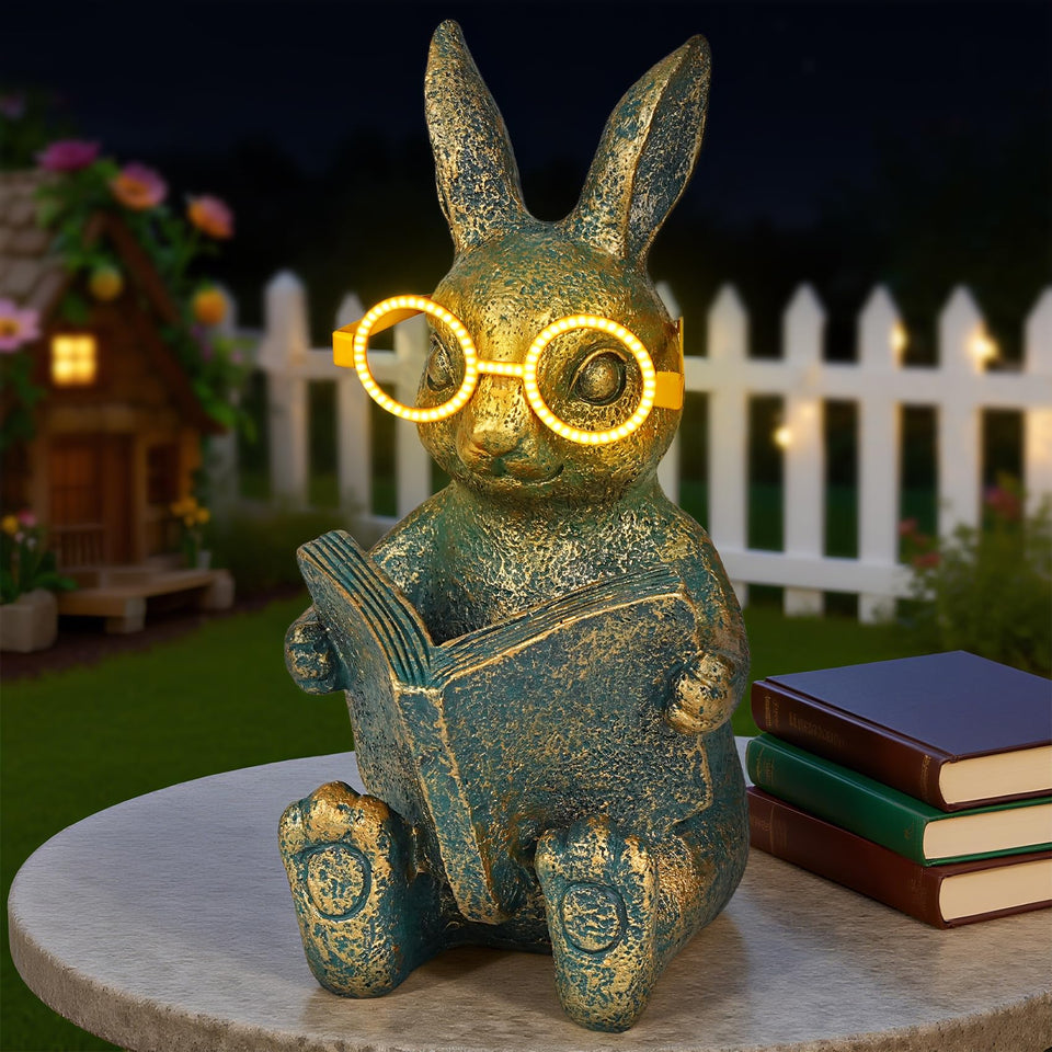 Zuzuzen Solar Rabbit statue with glowing glasses lights up gardens at night.