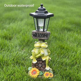 ZYLiWoo frog statue glows softly, creating magical garden atmosphere.