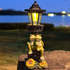 ZYLiWoo frog statue side-lit view highlights charming outdoor lighting for patios.